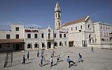 Arab Israeli Christian schoolchildren play soccer at the Terra Sancta School in the mixed Jewish-Arab city of Ramle, May 26, 2015. (AP/Oded Balilty)