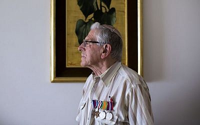 British Jewish World War II veteran Norman Cohen, who landed on the beaches of Normandy on D-Day with the British 2nd Army as a radio operator under the command of General Miles Dempsey, poses for a photo at his home in Jerusalem, May 2015. (AP Photo/Oded Balilty)