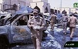 File: In this still image taken from video provided by Saudi TV, burnt out cars are seen as investigators collect evidence, in the aftermath of a suicide bomb outside the the Imam Hussein mosque in the port city of Dammam, Saudi Arabia, Friday, May 29, 2015. (Saudi Television via AP)