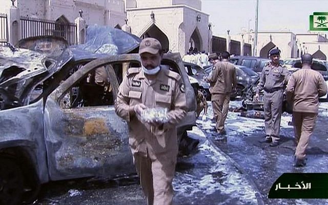 File: In this still image taken from video provided by Saudi TV, burnt out cars are seen as investigators collect evidence, in the aftermath of a suicide bomb outside the the Imam Hussein mosque in the port city of Dammam, Saudi Arabia, Friday, May 29, 2015. (Saudi Television via AP) File: In this still image taken from video provided by Saudi TV, burnt out cars are seen as investigators collect evidence, in the aftermath of a suicide bomb outside the the Imam Hussein mosque in the port city of Dammam, Saudi Arabia, Friday, May 29, 2015. (Saudi Television via AP)