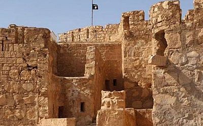 The Islamic State flag raised on top of Palmyra castle, May 22, 2015. (The website of Islamic State fighters via AP)
