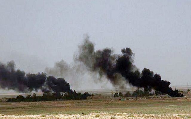 Black columns of smoke rise through the air during a battle between Islamic State militants and Syrian government forces on a road between Homs and Palmyra, Syria in this picture published Wednesday, May 21, 2015 (the website of Islamic State militants via AP) Black columns of smoke rise through the air during a battle between Islamic State militants and Syrian government forces on a road between Homs and Palmyra, Syria in this picture published Wednesday, May 21, 2015 (the website of Islamic State militants via AP)