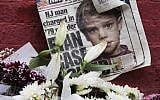 This May 28, 2012 file photo shows a newspaper with a photograph of Etan Patz at a makeshift memorial in the SoHo neighborhood of New York where Patz lived before his disappearance on May 25, 1979.  (AP/Mark Lennihan)