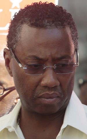 In this Aug. 5, 2013 photo, Norman Seabrook, president of the Correction Officers' Benevolent Association is seen at a campaign event in New York.  On May 27, 2015 federal investigators opened an investigation into the union for fraud. (AP/Bebeto Matthews)