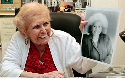 Jean Nidetch, founder of Weight Watchers, holds up a photo of herself at her home in Parkland, Fla. in 2011. (AP Photo/Alan Diaz, File)