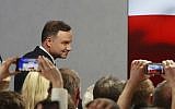 Main opposition candidate Andrzej Duda greets supporters during his election night as first exit polls show he won the first round of the presidential balloting, in Warsaw, Poland, Sunday, May 10, 2015. (Photo credit:  AP/Czarek Sokolowski)