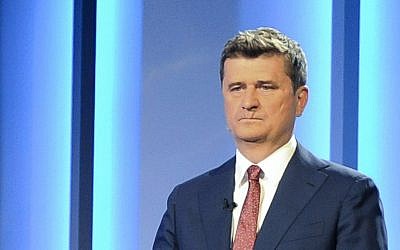 In this May 5, 2015 photo Janusz Palikot, the head of a left-wing party who is running for the Polish presidency in Sunday's election, waits for the start of a presidential debate in Warsaw, Poland. (AP Photo/Alik Keplicz)