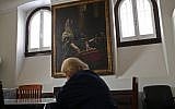 Illustrative: In this photo taken on Tuesday, May 5, 2015, a Jewish woman reads a book at the main Jewish synagogue in Lisbon. Portugal enacted in March 2015 a law to grant citizenship to descendants of Sephardic Jews exiled during the Inquisition 500 years ago. (AP Photo/Francisco Seco)