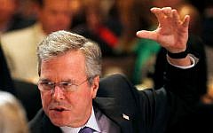 Former Florida Gov. Jeb Bush talks to attendees at his table prior to delivering the keynote address at the Republican National Committee spring meeting Thursday, May 14, 2015, in Scottsdale, Arizona. (AP Photo/Ross D. Franklin)