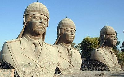 Thirty-foot tall bronze statues of the late dictator Saddam Hussein in Baghdad. The sculptures once sat atop towers in the Iraqi palace but were removed following the overthrow of the Baath regime. (Photo credit: Wikimedia commons)