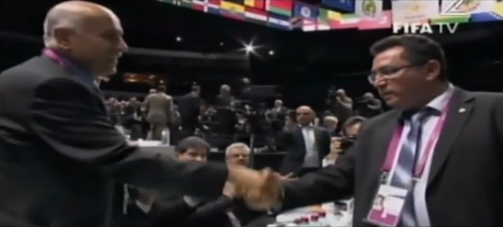 Ofer Eini (right), Israel's soccer chief, shakes hands with his Palestinian counterpart Jibril Rajoub at FIFA's Zurich congress, May 29, 2015 (screen capture: Channel 2) Ofer Eini (right), Israel's soccer chief, shakes hands with his Palestinian counterpart Jibril Rajoub at FIFA's Zurich congress, May 29, 2015 (screen capture: Channel 2)