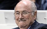 FIFA president Sepp Blatter smiles at the 65th FIFA Congress at the Hallenstadion in Zurich, Switzerland, Friday, May 29, 2015, where he was elected to a fifth term as FIFA boss (Walter Bieri/Keystone via AP)
