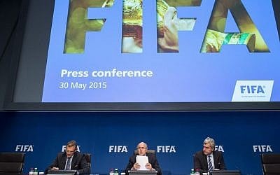 FIFA President Sepp Blatter, center, speaks next to Jerome Valcke, FIFA Secretary General, left, and Walter De Gregorio, Director Communications and Public Affairs, right, during a news conference following the FIFA Executive Committee meeting in Zurich, Switzerland, on Saturday, May 30, 2015. (Ennio Leanza/Keystone via AP)