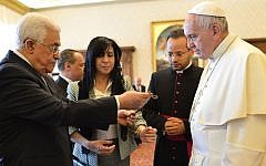 Pope Francis exchanges gifts with Palestinian Authority President Mahmoud Abbas during an audience at the Vatican Saturday, May 16, 2015.(Alberto Pizzoli/Pool Photo via AP)
