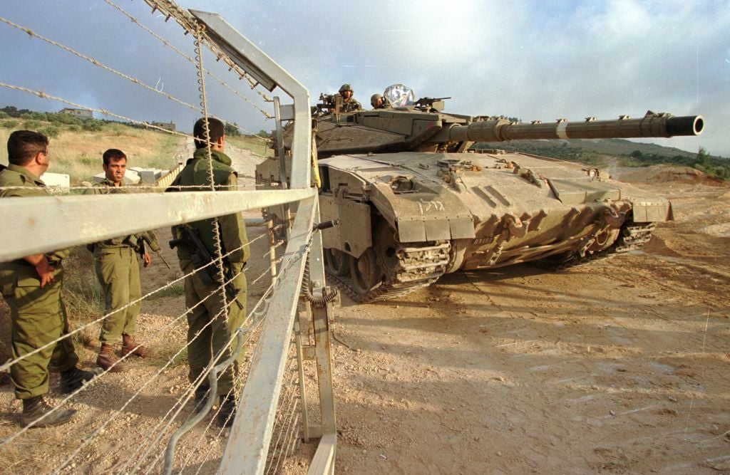 Israeli troops open the gates on the northern border for a tank during the IDF's 2000 withdrawal from Lebanon. (Photo by Flash90) Israeli troops open the gates on the northern border for a tank during the IDF's 2000 withdrawal from Lebanon. (Photo by Flash90)