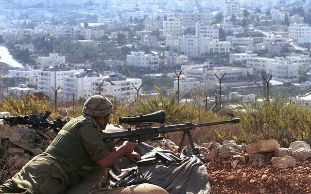 Israeli sniper during clashes in Beit Jala on March 26, 2001. (Nati Shohat/ Flash90) 