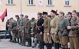 Far-right activists march in Lviv, Ukraine, wearing the uniform of the 14th Waffen Grenadier Division of the SS, an elite Nazi unite with many ethnic Ukrainians also known as the 1st Galician. in 2012. (Screen capture; YouTube)