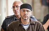 Abdullah Barghouti is taken to Jerusalem Magistrate's Court to testify as part of a US civil lawsuit against the Palestinian leadership, on June 20, 2012. (Noam Moskowitz/Flash90)