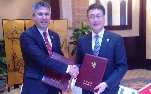 Israel Tax Authority head Moshe Asher (L)) with China's Customs Minister Sun Yibiao at the signing of the AEO agreement in Beijing on Tuesday, May 26 2015 (Photo credit: Courtesy) Israel Tax Authority head Moshe Asher (L)) with China's Customs Minister Sun Yibiao at the signing of the AEO agreement in Beijing on Tuesday, May 26 2015 (Photo credit: Courtesy)