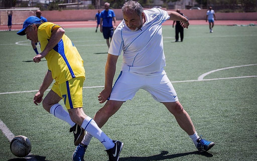 Yisrael Beytenu party leader, Avigdor Liberman, and his party members play soccer in Jerusalem against a team of the Russian Jewish Congress members, marking the victory day on Nazi Germany, 70 years ago, May 7, 2015. (Hadas Parush/Flash90)