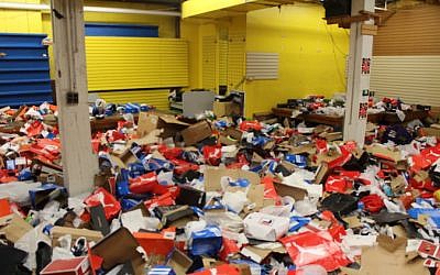 The inside of Sports Mart in downtown Baltimore was a sea of shoe boxes and other debris after being looted, April 29, 2015. (photo credit: JTA/Hillel Kuttler)