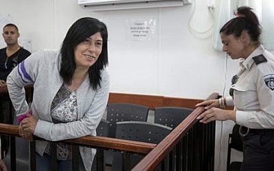 In this Thursday, May 21, 2015 file photo, Palestinian Parliament member Khalida Jarrar of the Popular Front for the Liberation of Palestine attends a court session charged with inciting violence, at the Israeli Ofer military base near the West Bank city of Ramallah (AP/Majdi Mohammed, File)