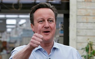 Britain's Prime Minister and Conservative Party leader David Camer gestures to supporters in Twickenham, London, Tuesday May 5, 2015 (photo credit: AP/Peter Nicholls, Pool)