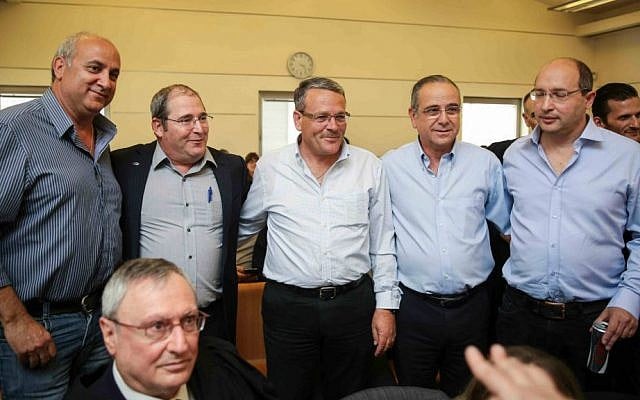 Chairman of the Histadrut, Avi Nissenkorn (R), President of the Industries Union Shraga Brosh, Chairman of the Dead Sea Factories Committee, Armand Lankri; CEO of the Israel Company, Nir Gilad; and Chairman of Israel Chemicals, Avner Ben-Senior, at Jerusalem Labor Court on March 11, 2015, during a hearing on mass layoffs of hundreds of workers at Israel Chemicals. (Photo credit: Hadas Parush/Flash90)