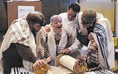 Illustrative photo: Disabled child reading from the Torah with the Masorti movement in Israel. (via Facebook)