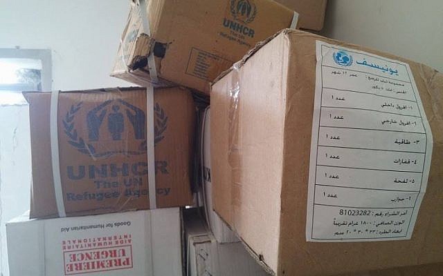 A photo published on the website of the Syrian National Coalition shows boxes of UN and Red Cross food parcels and relief aid found in a Syrian army base on Tuesday, May 19, 2015. According to the coalition, the Syrian army steals relief aid intended for the civilian population. (Courtesy Syrian National Coalition) A photo published on the website of the Syrian National Coalition shows boxes of UN and Red Cross food parcels and relief aid found in a Syrian army base on Tuesday, May 19, 2015. According to the coalition, the Syrian army steals relief aid intended for the civilian population. (Courtesy Syrian National Coalition)