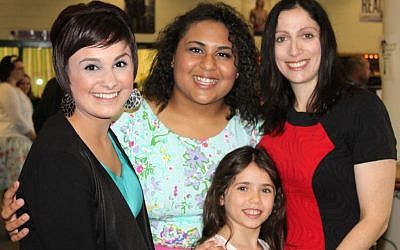 Students Maria Morava, left, and Breeana Clayton, second from left, with Suzanne Goldberg and her daughter, Shira. (photo credit: JTA/Molly McGowan Gorsuch)
