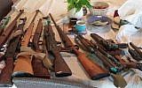 Rifles found in the attic of the house of an elderly woman living on Kibbutz Shoval, May 2015. (photo credit: Israel Police)