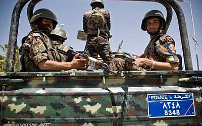 Shiite fighters, known as Houthis, wearing army uniforms escort the convoy of Ismail Weld al-Sheikh, new UN special envoy to Yemen, at the international airport in Sanaa, Yemen, Tuesday, May 12, 2015. (AP/Hani Mohammed)