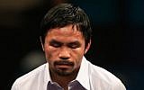 Manny Pacquiao answers questions during a post-fight news conference after losing to Floyd Mayweather, Jr. in their welterweight unification championship bout on May 2, 2015 at MGM Grand Garden Arena in Las Vegas, Nevada. (Jamie Squire/Getty Images/AFP)