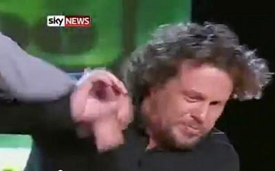 Newspaper owner Alexander Lebedev punches Sergei Polonsky on Russian television in 2011. Polonsky, who fled Israel in 2013 when a warrant for his arrest was issued in Russia, was deported from Cambodia to face embezzlement charges in May 2015. (Screen capture: YouTube/ Sky News)
