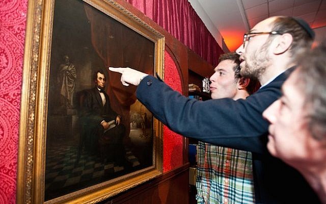 At a Brandeis event on April 28, 2015, visitors view Solomon Nunes de Carvalho’s 1865 portrait of Abraham Lincoln. (JTA/Ashley McCabe/Brandeis University) At a Brandeis event on April 28, 2015, visitors view Solomon Nunes de Carvalho’s 1865 portrait of Abraham Lincoln. (JTA/Ashley McCabe/Brandeis University)