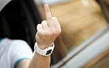 A driver flipping a middle finger. (middle finger image via Shutterstock)