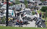 Law enforcement officers investigate a shooting in the parking lot of the Twin Peaks Restaurant Sunday, May 17, 2015, in Waco, Texas (Rod Aydelotte/Waco Tribune Herald via AP)
