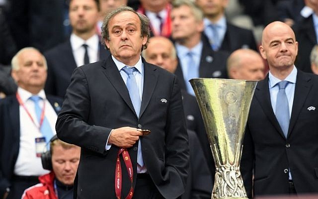 UEFA President Michel Platini (L) stands next to the UEFA Europa League trophy in Warsaw, Poland on May 27, 2015. (AFP/Piotr Hawale) UEFA President Michel Platini (L) stands next to the UEFA Europa League trophy in Warsaw, Poland on May 27, 2015. (AFP/Piotr Hawale)