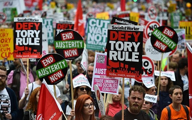 Demonstrators march to protest against the British government's spending cuts and austerity measures in London on June 20, 2015 (AFP PHOTO / BEN STANSALL) Demonstrators march to protest against the British government's spending cuts and austerity measures in London on June 20, 2015 (AFP PHOTO / BEN STANSALL)