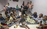 Children from families of African migrants gather at a so-called day-care center in southern Tel Aviv, on May 28, 2015. (Jack Guez/AFP)
