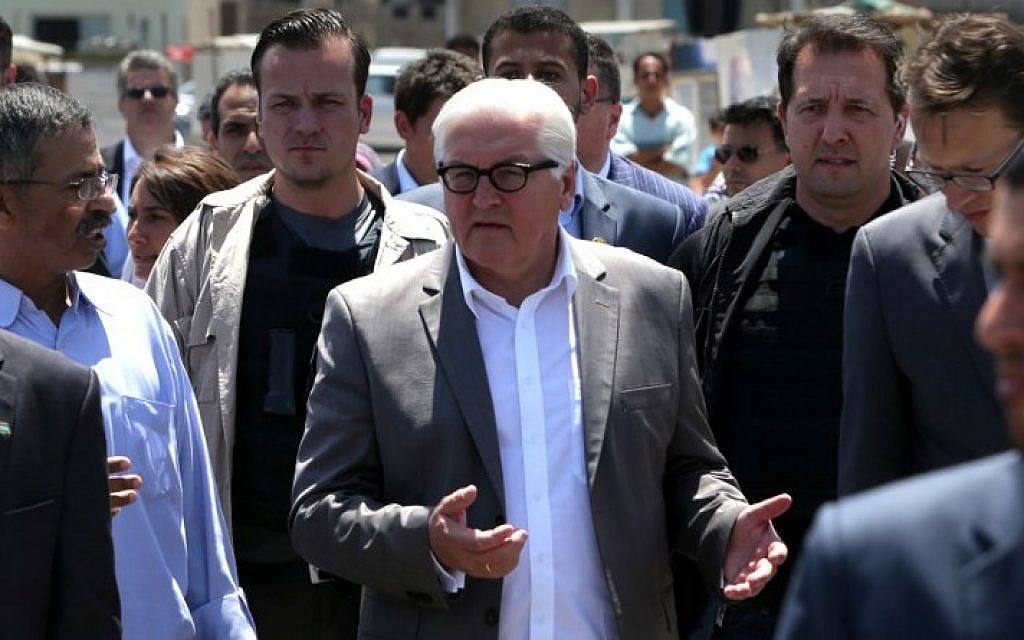 German Foreign Minister Frank-Walter Steinmeier, center, gestures during a visit to the sea port in Gaza City, June 1, 2015. (AFP/MAHMUD HAMS)