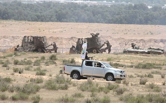 Hamas members patrol an area 300 meters from the Israeli border with Rafah in the southern Gaza Strip, where a road is being paved, on June 03, 2015. AFP PHOTO / SAID KHATIB Hamas members patrol an area 300 meters from the Israeli border with Rafah in the southern Gaza Strip, where a road is being paved, on June 03, 2015. AFP PHOTO / SAID KHATIB