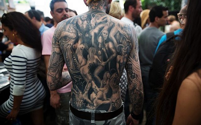 A man whose back is completely covered with tattoos takes part in the three-day annual tattoo festival on June 6, 2015 in Tel Aviv (Menahem Kahana/AFP)