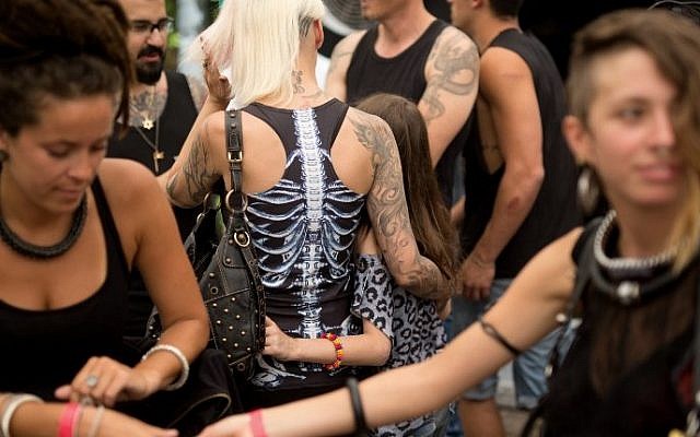 Visitors take part in the three-day annual tattoo festival on June 6, 2015 in Tel Aviv (Menahem Kahana/AFP)