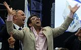 Oren Hazan celebrating the exit polls at the Likud headquarters after the elections, Tel Aviv, March 18, 2015. (AFP/Menahem Kahana)
