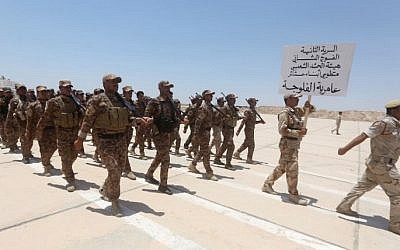 Iraqi Sunni volunteers from the Anbar province, part of the government fight against the Islamic State (IS) group, during their graduation ceremony at the Habaniyah military base, near Anbar province's capital Ramadi, June 17, 2015. (AFP/Ahmad al-Rubaye)