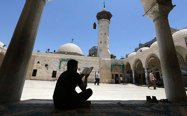 A Palestinian man reads a copy of the Koran, Islam's holy book, in a mosque on the first day of the holy fasting month of Ramadan in Gaza City, on June 18, 2015. (AFP PHOTO/MAHMUD HAMS) A Palestinian man reads a copy of the Koran, Islam's holy book, in a mosque on the first day of the holy fasting month of Ramadan in Gaza City, on June 18, 2015. (AFP PHOTO/MAHMUD HAMS)
