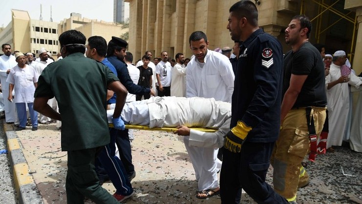 Kuwaiti security personnel and medical staff carry a man on a stretcher at the site of a suicide bombing that targeted the Shiite Al-Imam al-Sadeq mosque after it was targeted by a suicide bombing during Friday prayers on June 26, 2015, in Kuwait City. (AFP PHOTO / STR) Kuwaiti security personnel and medical staff carry a man on a stretcher at the site of a suicide bombing that targeted the Shiite Al-Imam al-Sadeq mosque after it was targeted by a suicide bombing during Friday prayers on June 26, 2015, in Kuwait City. (AFP PHOTO / STR)