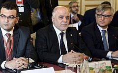 Iraqi Prime Minister Haider al-Abadi (C) and members of the anti-Islamic State coalition meet on June 2, 2015 in Paris, to discuss strategy in fighting the jihadists who have made key battlefield advances in recent weeks in Iraq and Syria. (AFP/ POOL/STEPHANE DE SAKUTIN)